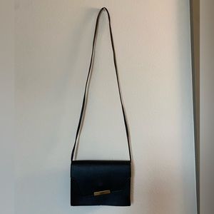 Black purse with gold accents